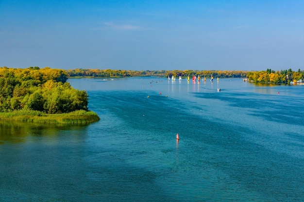 Many yachts at the river Dnieper on autumn in Kremenchug Ukraine Sailing regatta