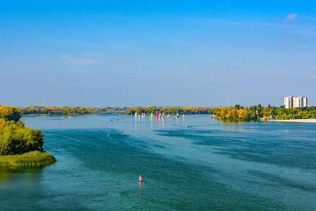 Many yachts at the river Dnieper on autumn in Kremenchug Ukraine Sailing regatta