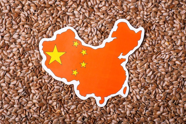 Map and flag of China on linen grain Concept of growing linen grain in China origin of seed