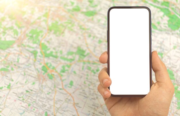 Map navigation mockup, man hold and use smartphone on background of city map, copy space photo