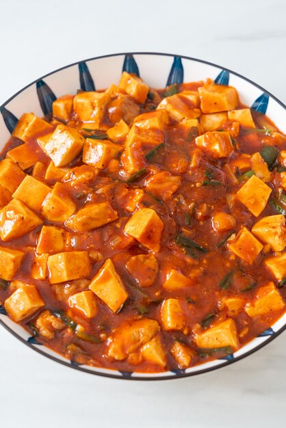 Mapo Tofu - The traditional Sichuan dish of silken tofu and ground beef, packed with mala flavor from chili oil and Sichuan peppercorns - Asian food style