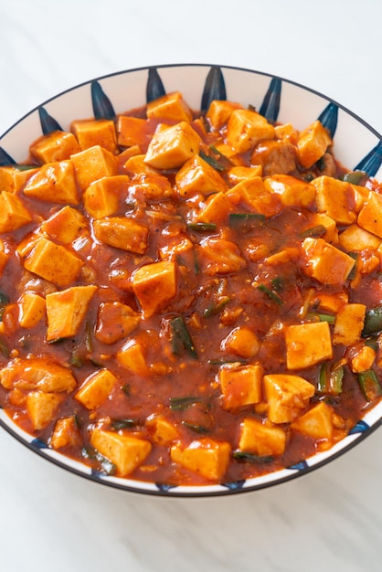 Mapo tofu - the traditional sichuan dish of silken tofu and\
ground beef, packed with mala flavor from chili oil and sichuan\
peppercorns - asian food style