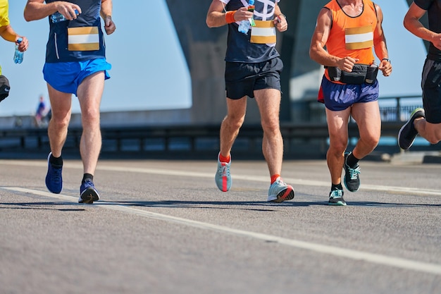 Marathon runners on city road fitness sport event