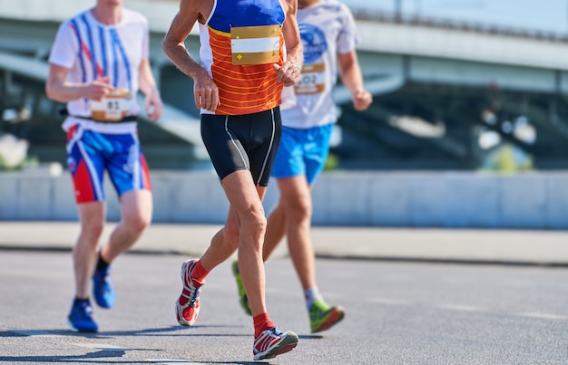 Marathon runners on city road