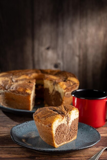 Marble cake and cup of coffee on the table