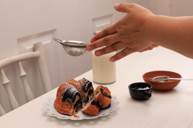 Marble Cake with Coffee with Powder Sugar and Kitchen Vintage Utensil, White Bakery Concept