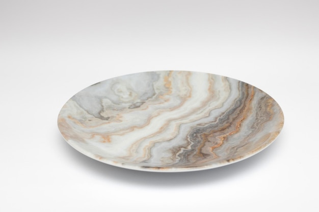 Marble ceramic plate on a white background