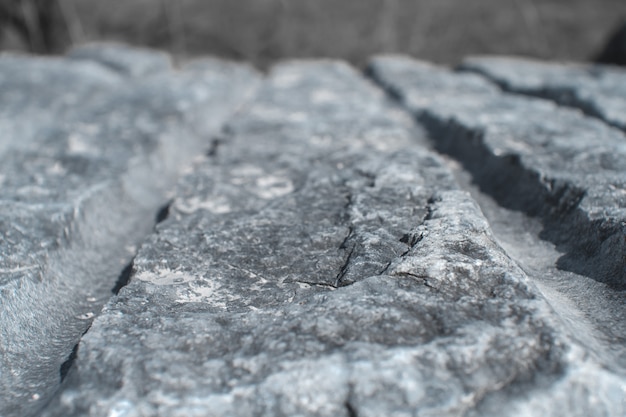 Marble in nature. The texture of cut gray stone. 