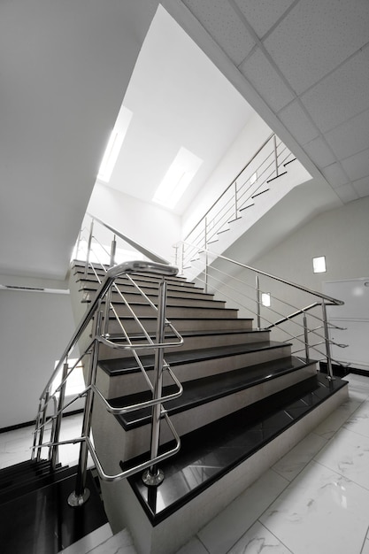 Marble staircase with a steel handrail