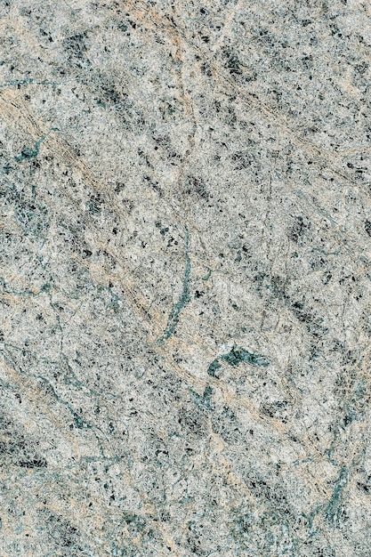Текстура мраморного камня с разнообразным рисунком с тонкими линиями.