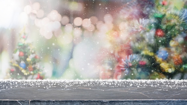 Marble table top and blurred lights with Christmas tree