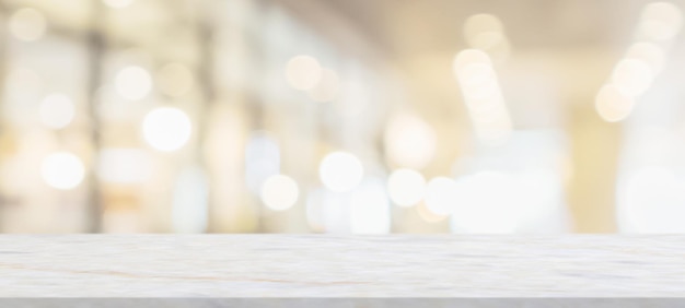 Marble table top with blurred abstract cafe restaurant interior background