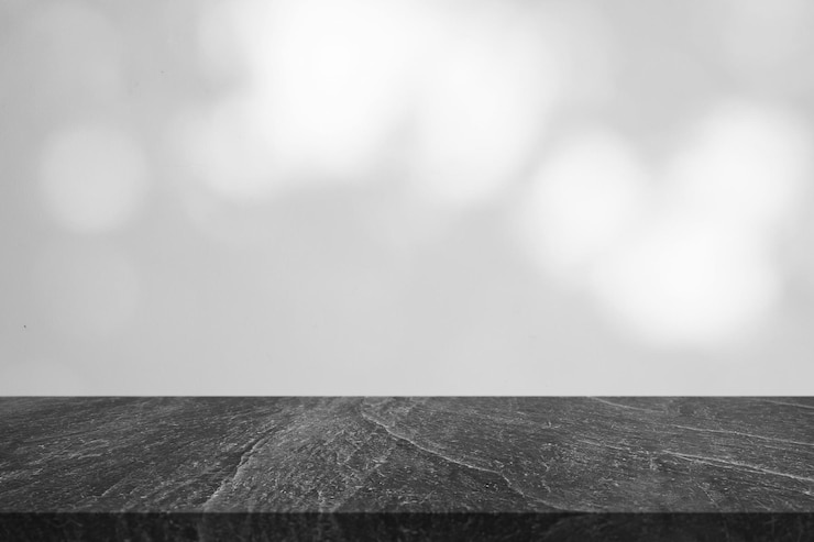 Photo marble table top with tree shadow drop on white wall background for mockup product display