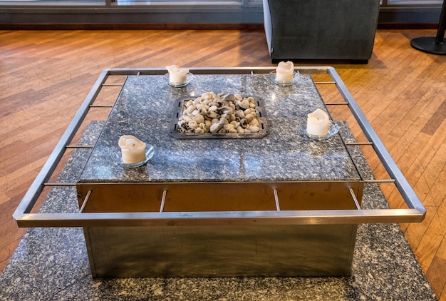 Marble table with rock on fireplace and candle