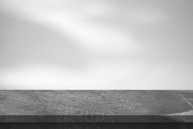 Photo marble table with tree shadow drop on white wall background for mockup product display