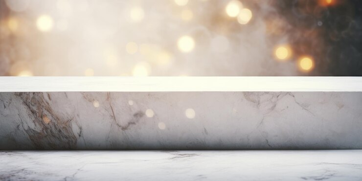 Photo marble table with white bokeh on concrete wall for presenting products