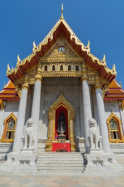 Marble temple is landmark of Bangkok Thailand under blue sky