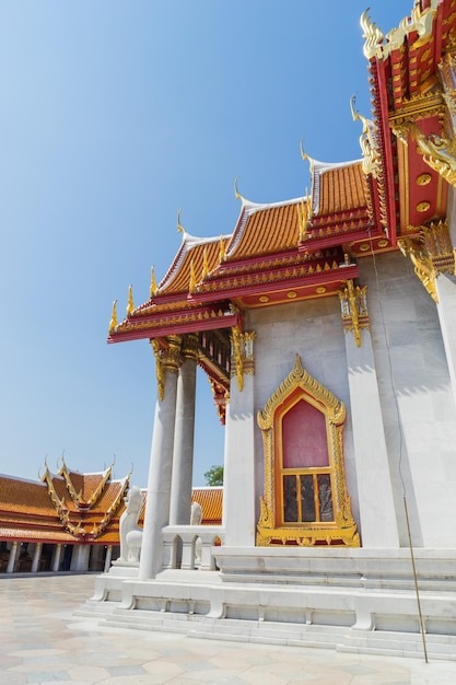 Marble temple is landmark of Bangkok Thailand under blue sky