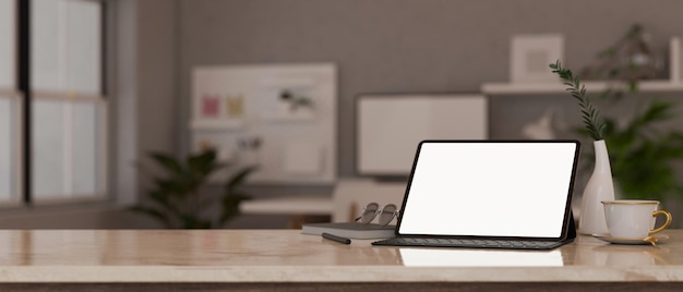 Marble workspace tabletop with tablet mockup and copy space over blurred working room