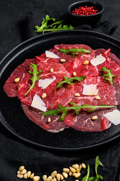 Marbled beef carpaccio with arugula and parmesan cheese