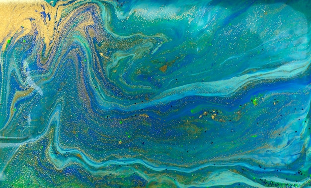 Marbled blue abstract background liquid marble pattern with gold powder