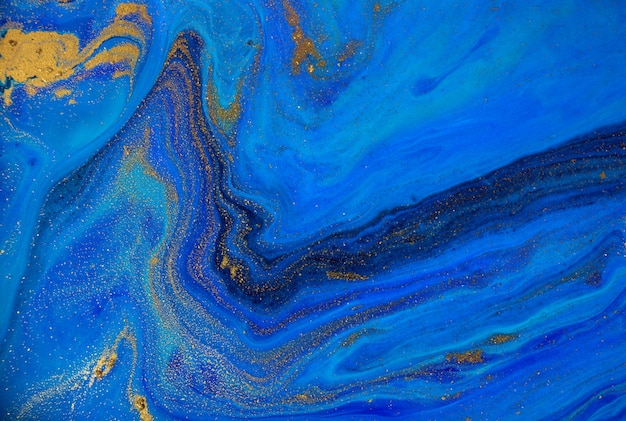 Marbled blue and gold ocean background. Liquid marble pattern.