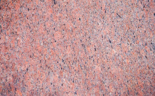 Marbled pattern of a smooth red stone slab