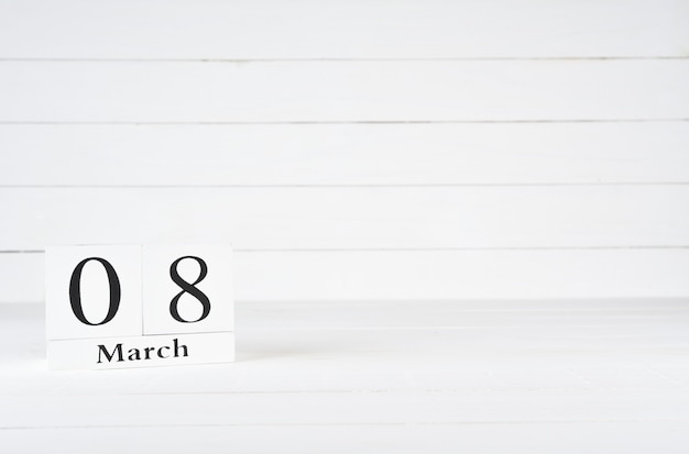 March 8th, Day 8 of month, Birthday, Anniversary, wooden block calendar on white wooden background with copy space for text.