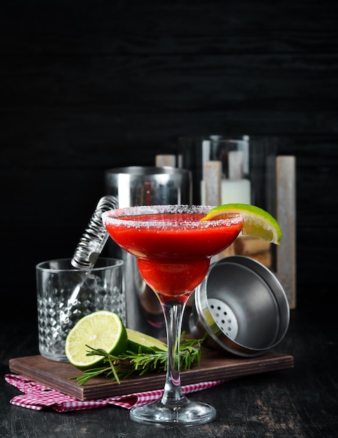 Margarita Strawberry Alcoholic cocktail On a wooden background Top view Free copy space