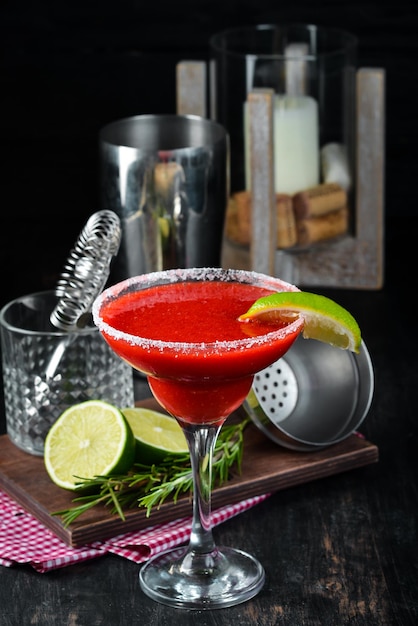 Margarita Strawberry Alcoholic cocktail On a wooden background Top view Free copy space