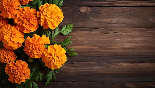 Marigold flowers on wooden background top view with copy space