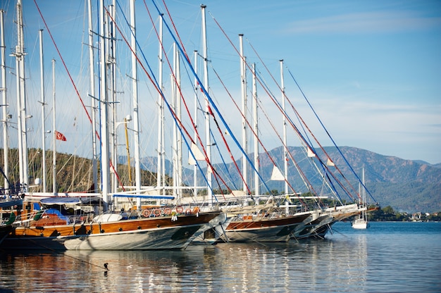 Marina at summer day with moored yachts