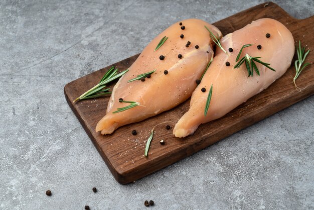 Marinate the fresh chicken breast on the cutting board