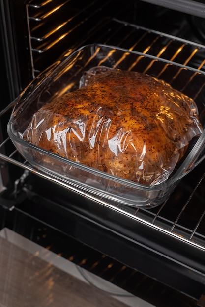 Photo marinated chicken breast in a bag for baking in the oven cooking healthy food at home