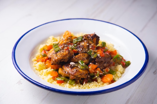 Marinated chicken with vegetables and couscous.