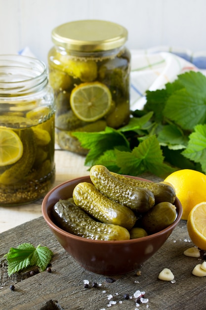 Marinated cucumbers in a bowl and jar