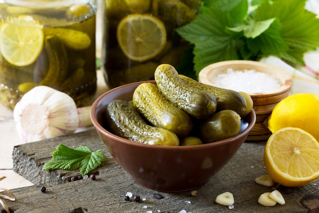 Marinated cucumbers in a bowl and jar