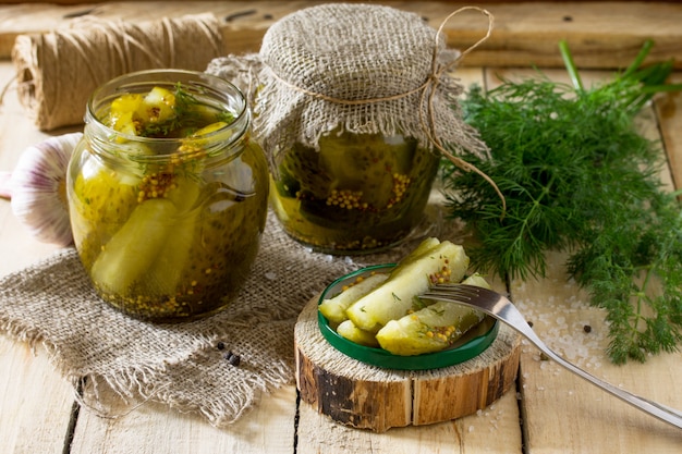 Marinated cucumbers with mustard in jars