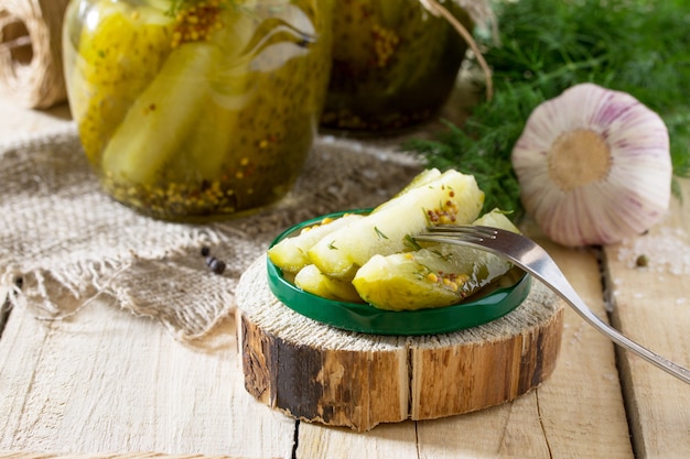 Marinated cucumbers with mustard in jars