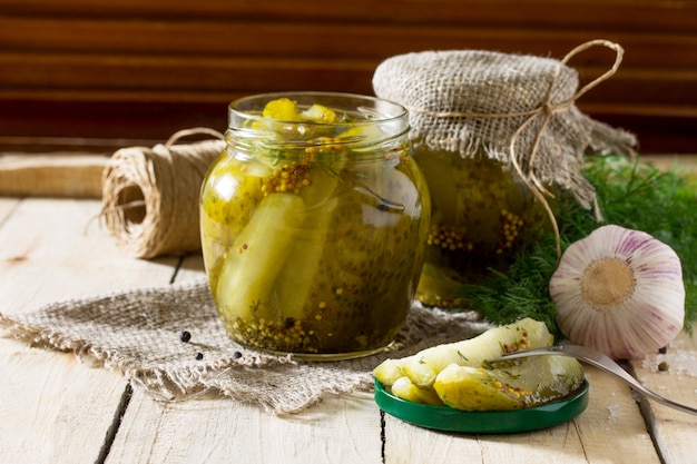 Marinated cucumbers with mustard in jars