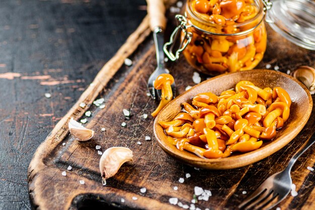 Marinated mushrooms on a cutting board