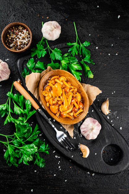 Marinated mushrooms on a plate with parsley