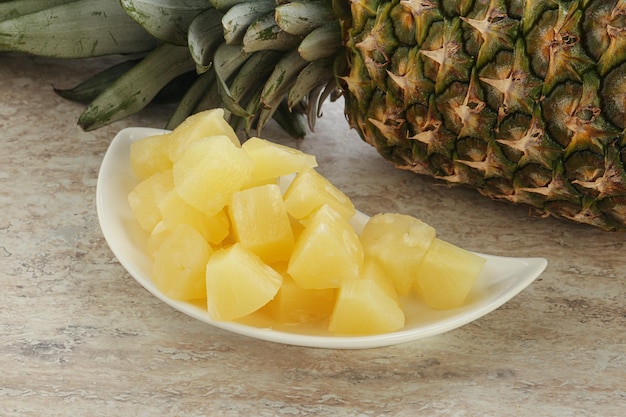 Marinated pineapple slices in the bowl