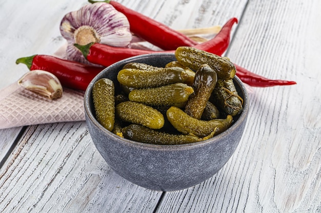 Marinated small cucumbers cornichon in the bowl