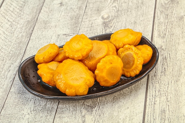 Marinated yellow patisson in the bowl