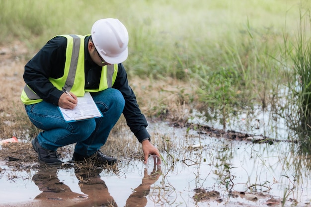 Marine biologist analysing water test results and algea samples