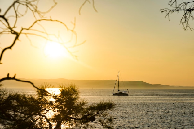 Marine vessel on the background of a scarlet sunset.