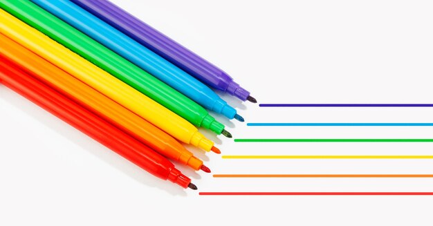 Markers of rainbow colors isolated on white background lgbtq rainbow flag gay pride background copy space