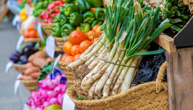 Market stalls with vegetables and fruits. Selective focus.