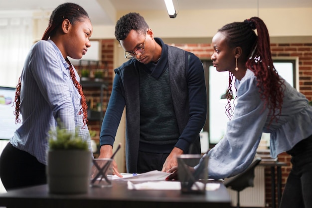 Marketing agency executive board discussing about bankruptcy possibility and poor management. Development company business people talking about marketing solutions while in office